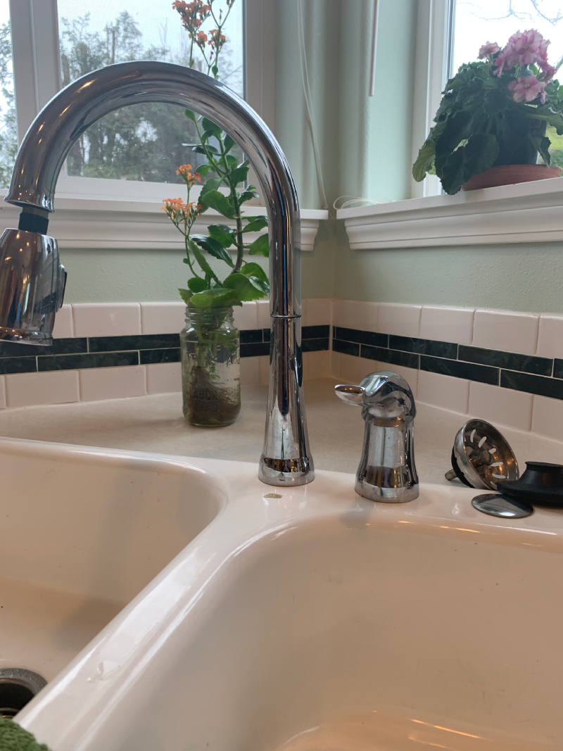 kitchen sink with a single-handle pull-down kitchen faucet