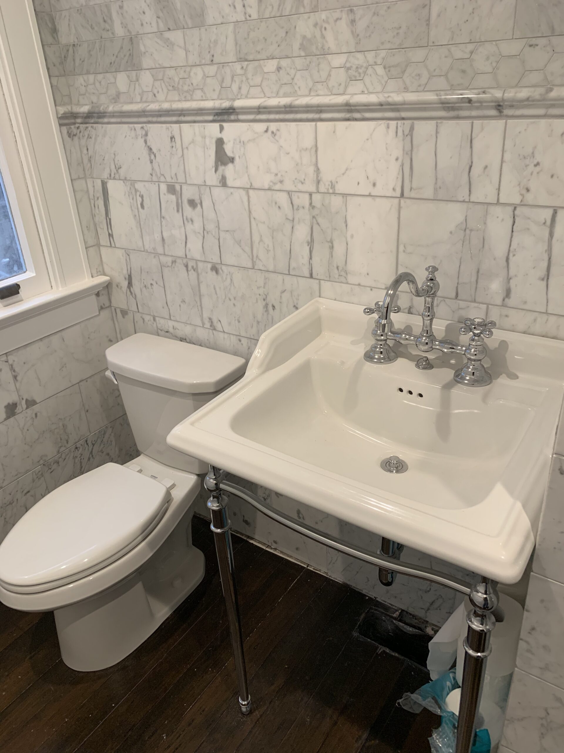 bathroom featuring a toilet and a pedestal sink" title="bathroom featuring a toilet and a pedestal sink